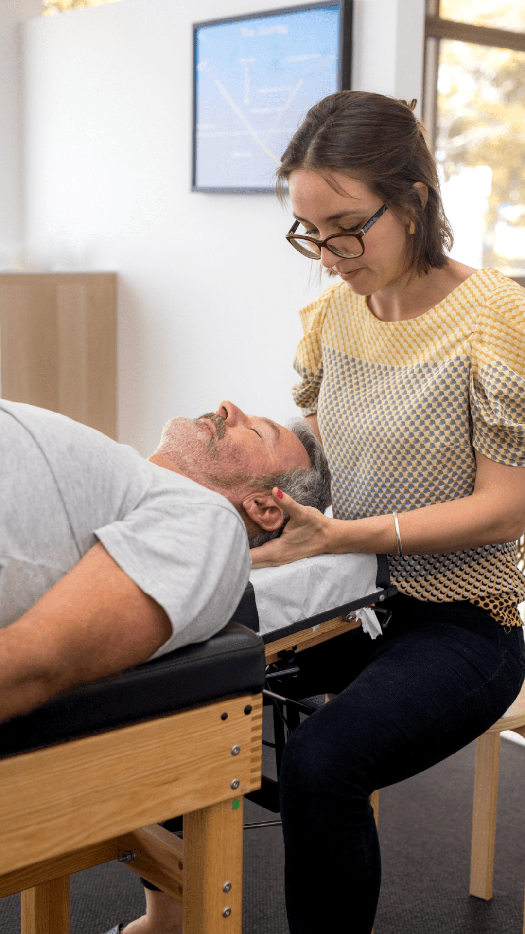 Chiropractor adjusting a patient